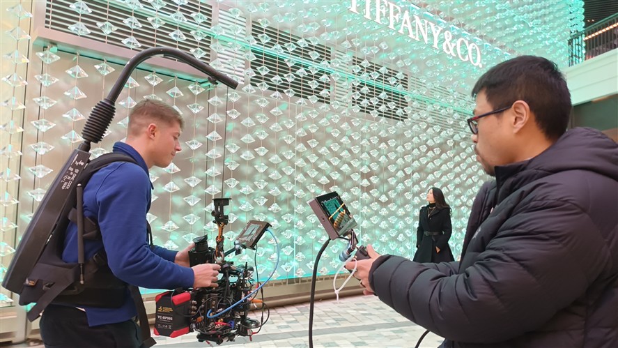Hangzhou crew members discussing a shoot plan